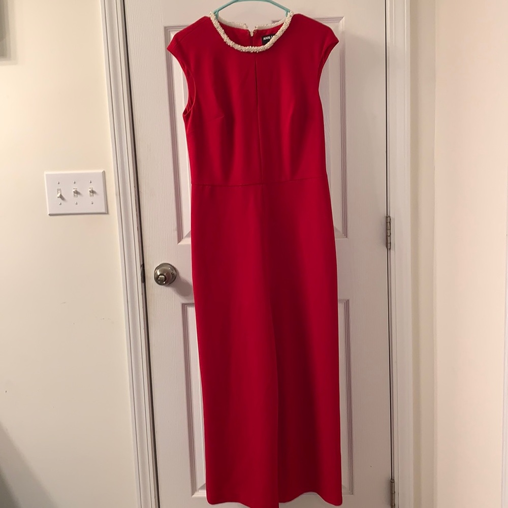 Red jumpsuit with pearl and rhinestone trimmed neck